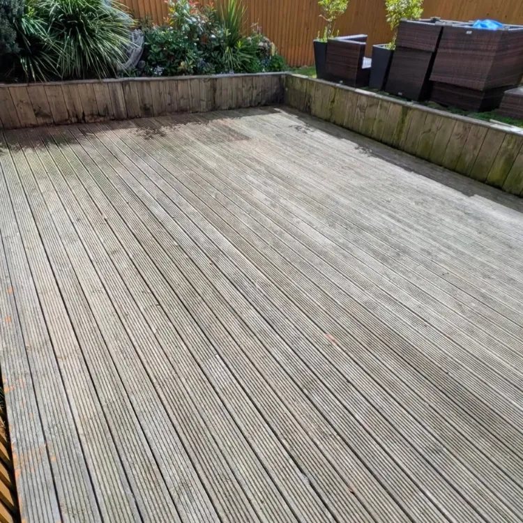 Timber decking before cleaning, grey and weathered