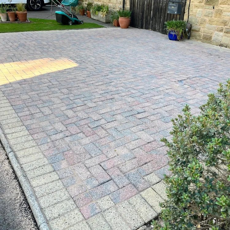 The same driveway after pressure washing, the colour of the blocks showing again